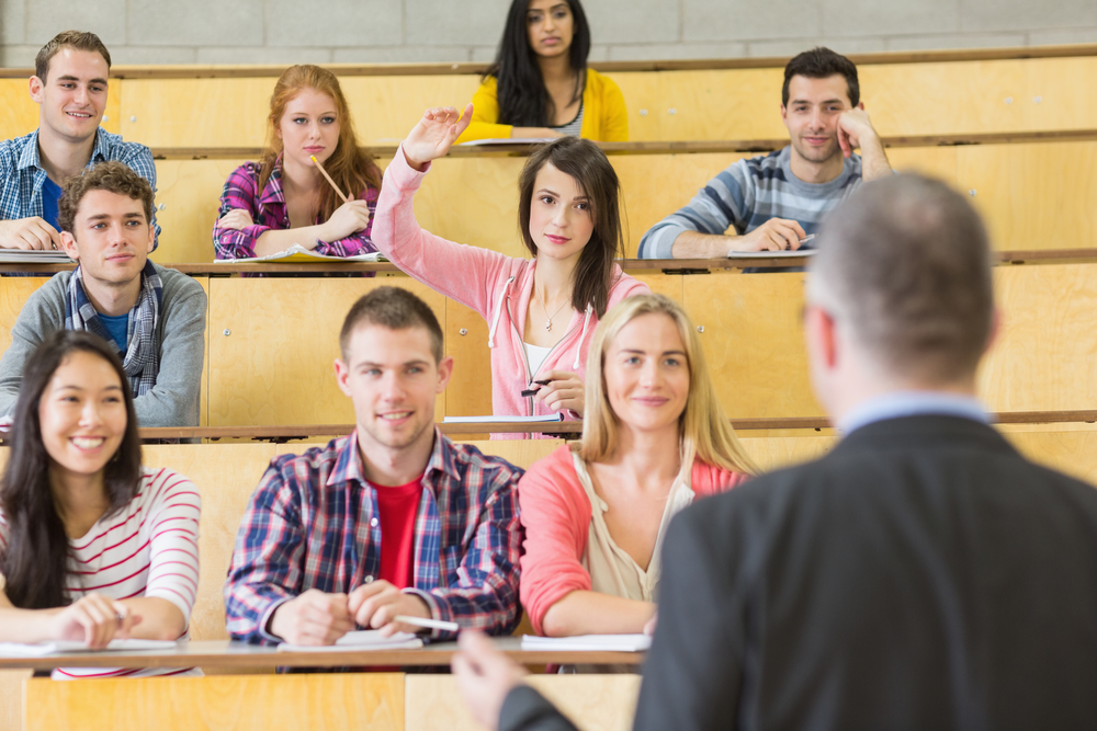 College Students in Lecture Hall with Professor