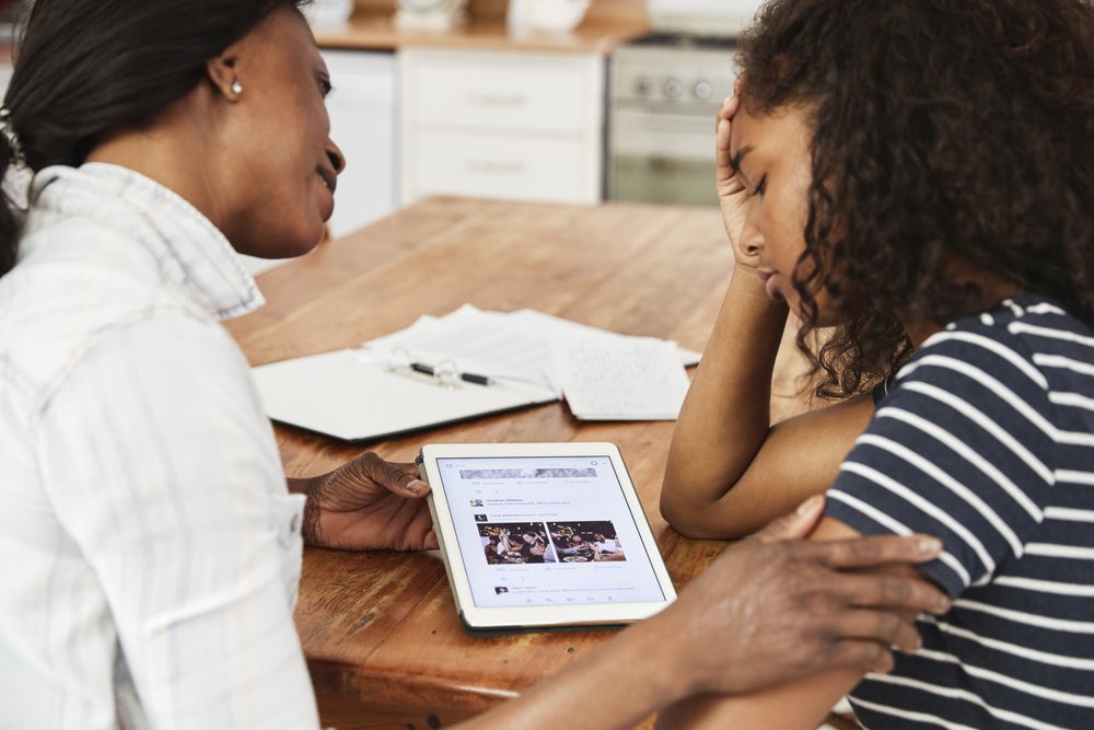 Help Child with ADHD Sad Teen Mom Comforting Teen Doing Homework