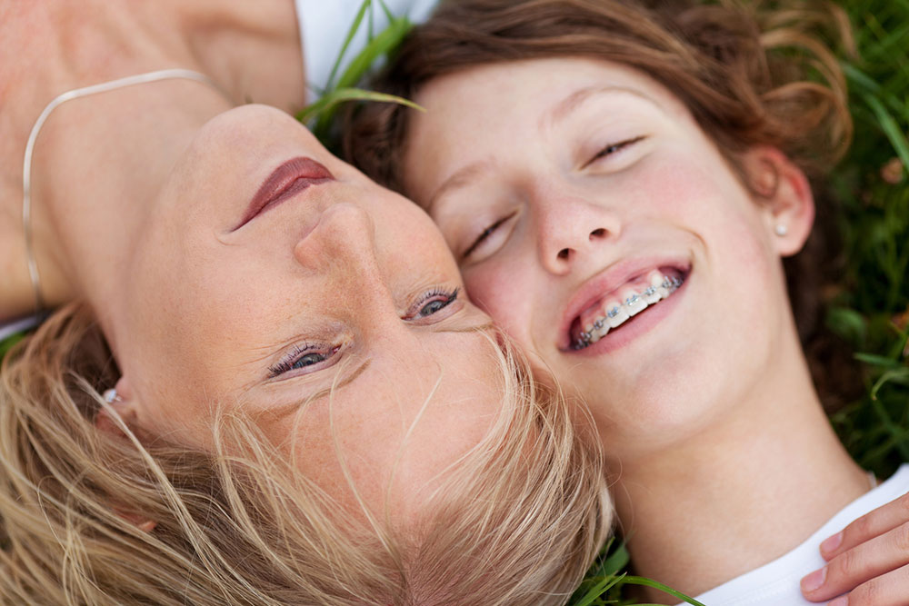 Mother and Daughter Lying in Grass