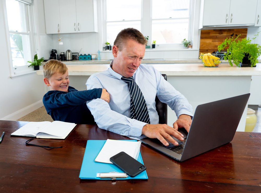 Dad Working Kid Bothering Him at Home