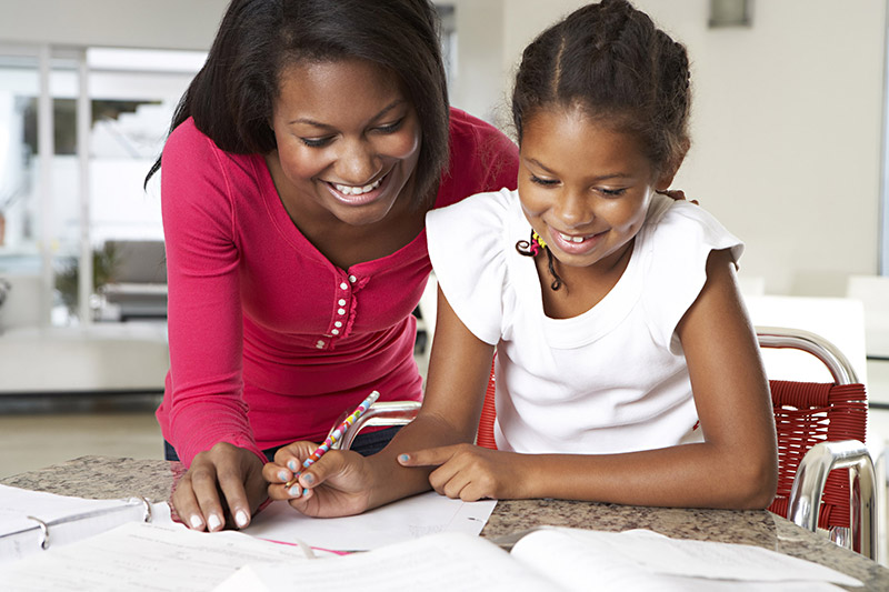 Mom and Girl Doing Homework